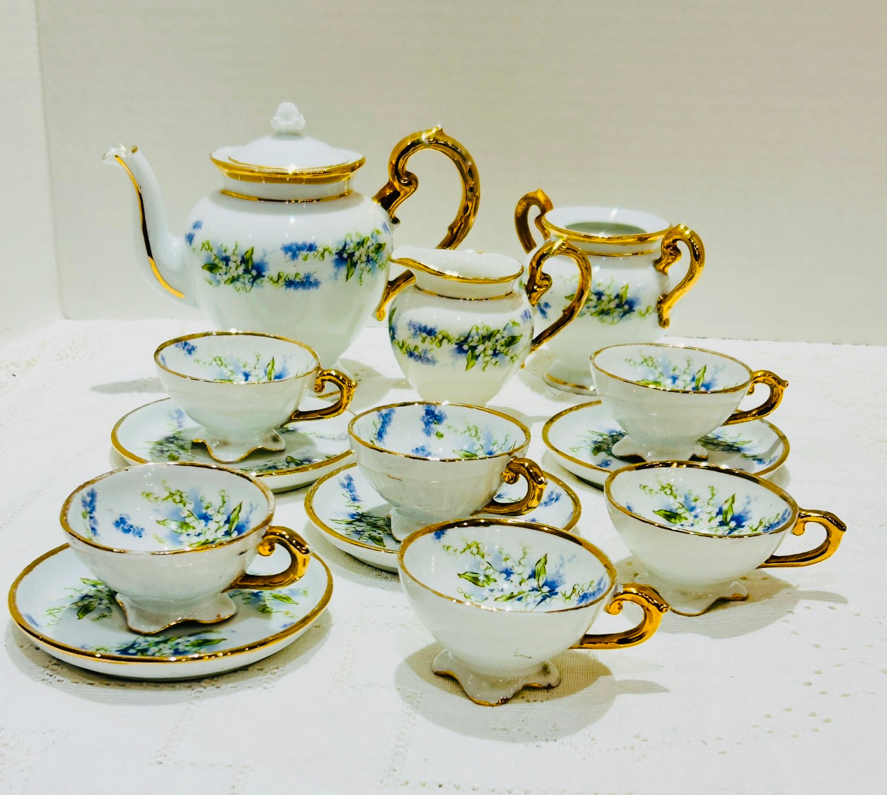 vintage Porcelain Child’s Tea Set - Teacuos & Saucers - white vase - blue floral sprays