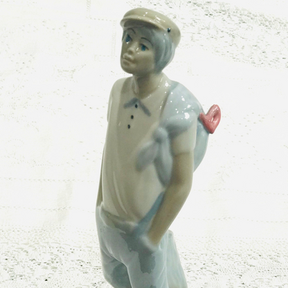 Boy with Cap & Slung Bag – Ceramic Figurine in the Style of Nao | Unmarked Collectible Ornament