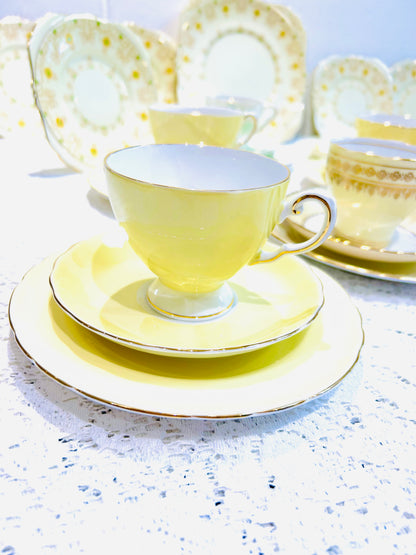 Mismatched vintage yellow tea set, perfect for an afternoon tea. Includes beautiful pieces by Tuscan and Royal Grafton China