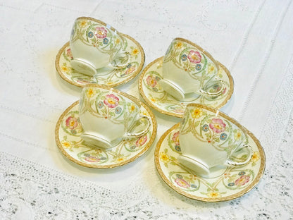 A set of 4 Small Floral Teacups & Saucers