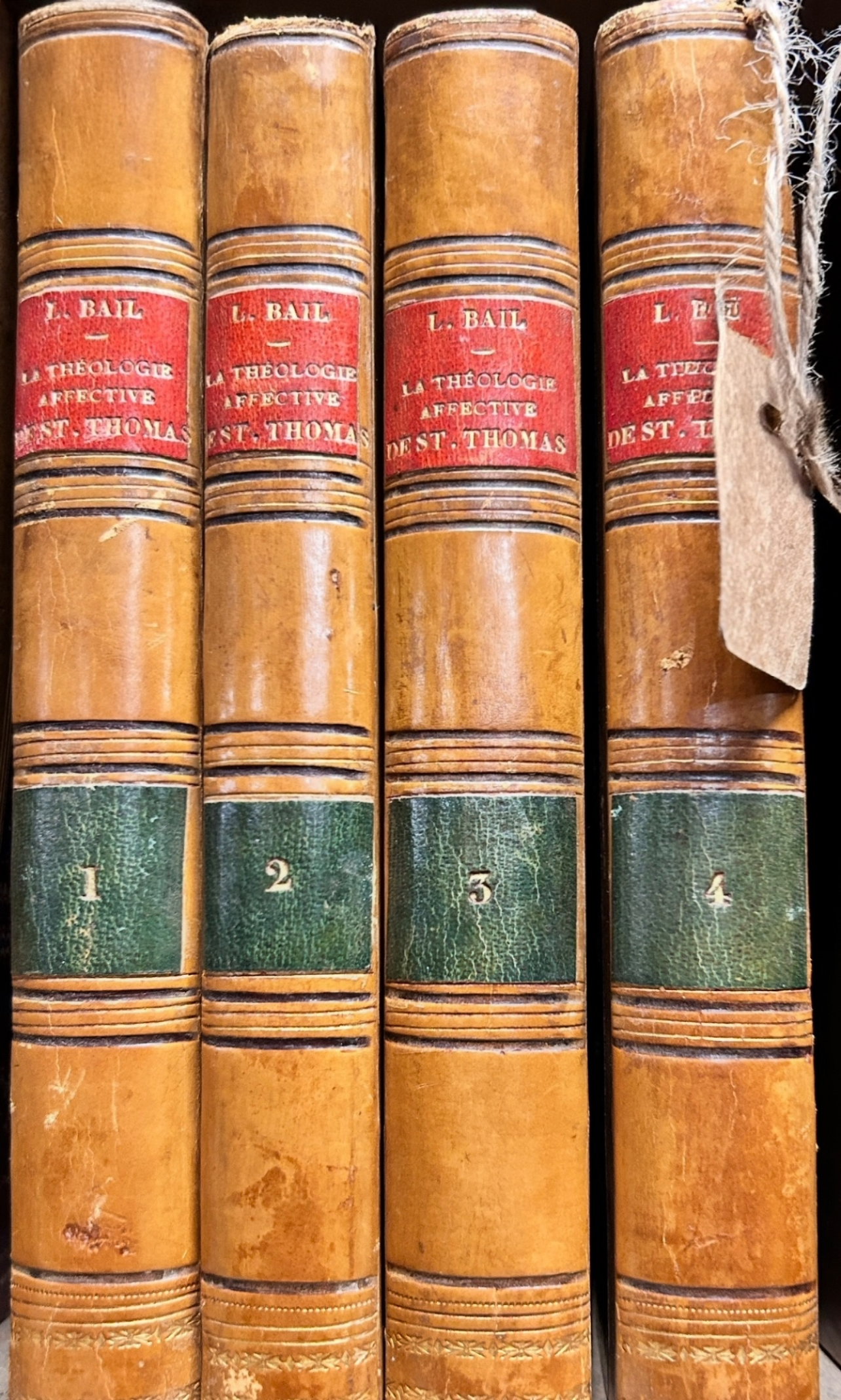 La Théologie Affective de St. Thomas – 4-Volume Set by L. Bail, Vintage Leather-Bound Theology Theology Book Set - Four vintage leather-bound theology books titled La Théologie Affective de St. Thomas by L. Bail, with red and green spine labels and numbered volumes 1–4.