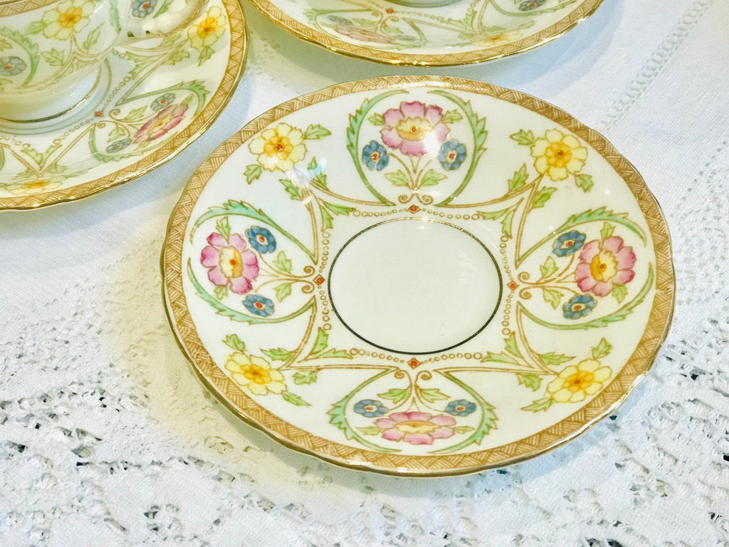 A set of 4 Small Floral Teacups & Saucers