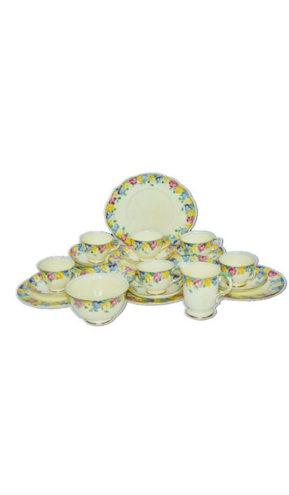 Vintage Crown Staffordshire tea set for six, crafted in fine bone china with vibrant multicoloured floral patterns and gold trim. This complete set of cups, saucers, and plates is a true English classic, highly sought after by collectors across the UK and Europe.