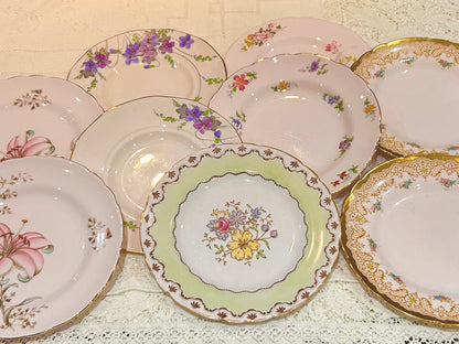 A set of 9 Tuscan Vintage Pink Tea Plates.  Excellent condition. A pretty vintage mixed set made in England by Tuscan China. A pink mis matched set. Fully backstamped. Lots of pretty flower in shades of pink, purple and yellow.  Diameter 7". 