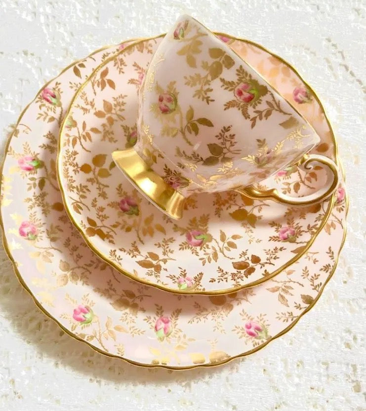 A stunning Vintage Pink Tuscan China Teacup, Saucer and Tea Plate crafted in fine bone china and adorned with elegant pink roses, perfect for traditional afternoon tea or special occasions. 