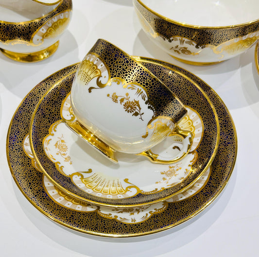 Five Tuscan Plant teacups and saucers, 1930s vintage bone china with gold trim and dark accent, scalloped edges, made in England.